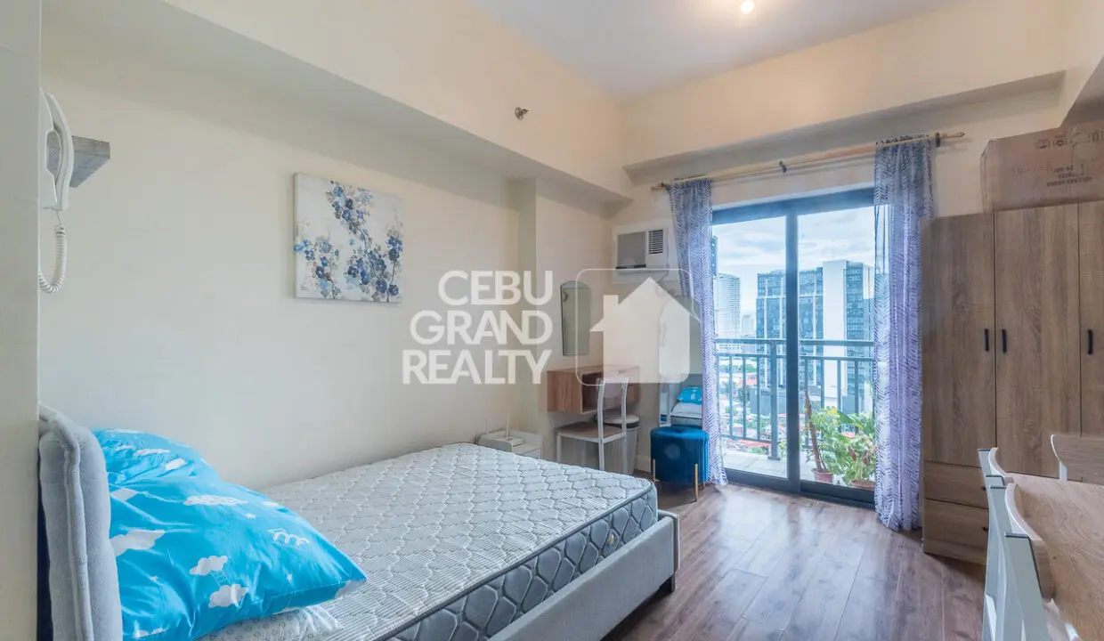 RCGR4 Furnished Studio with Balcony and City View in Grand Residences - Cebu Grand Realty 1