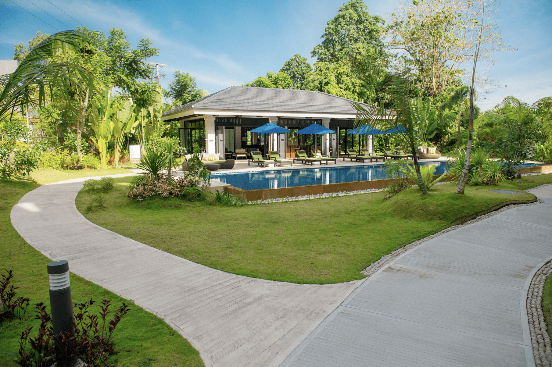 Pool, clubhouse, and landscaped garden at 32 Sanson by Rockwell