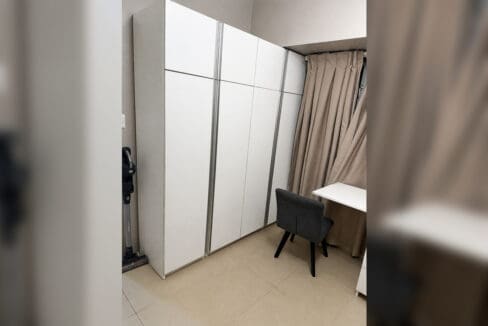 Built-in wardrobes and desk chair in the bedroom