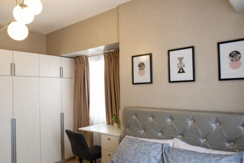 Bedroom with floor-to-ceiling wardrobes and built-in study desk