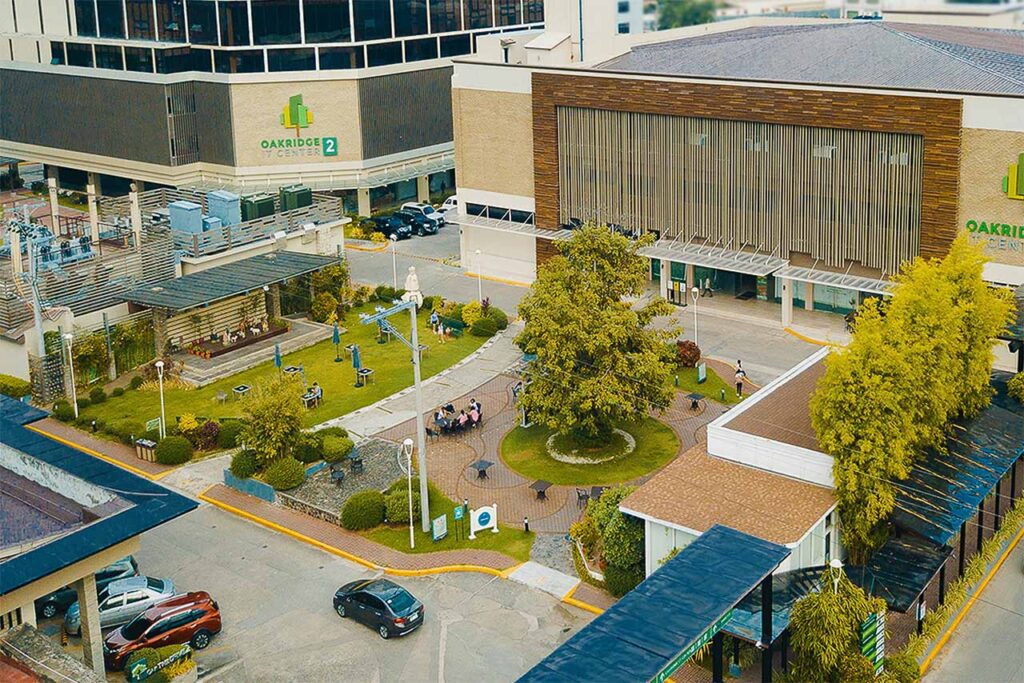 Oakridge Center buildings with open garden courtyard and outdoor seating area