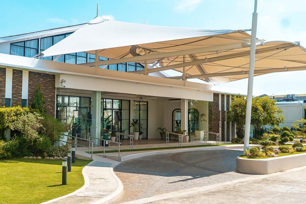 Modern clubhouse or commercial building with canopy entrance at Oakridge Business Park