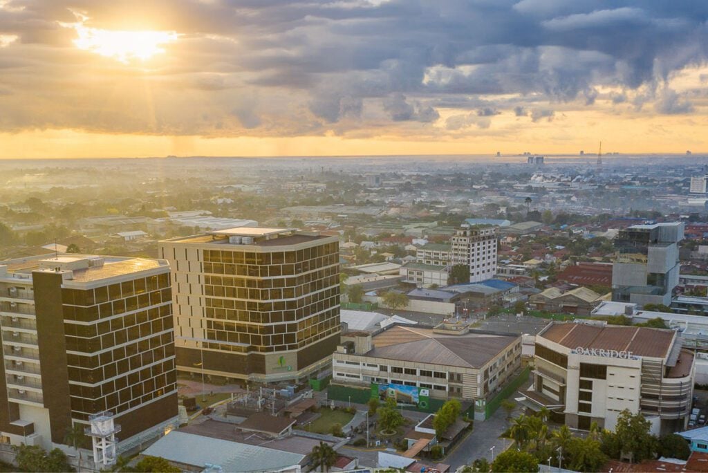 Sunset aerial view of Oakridge Business Park and surrounding Cebu City skyline