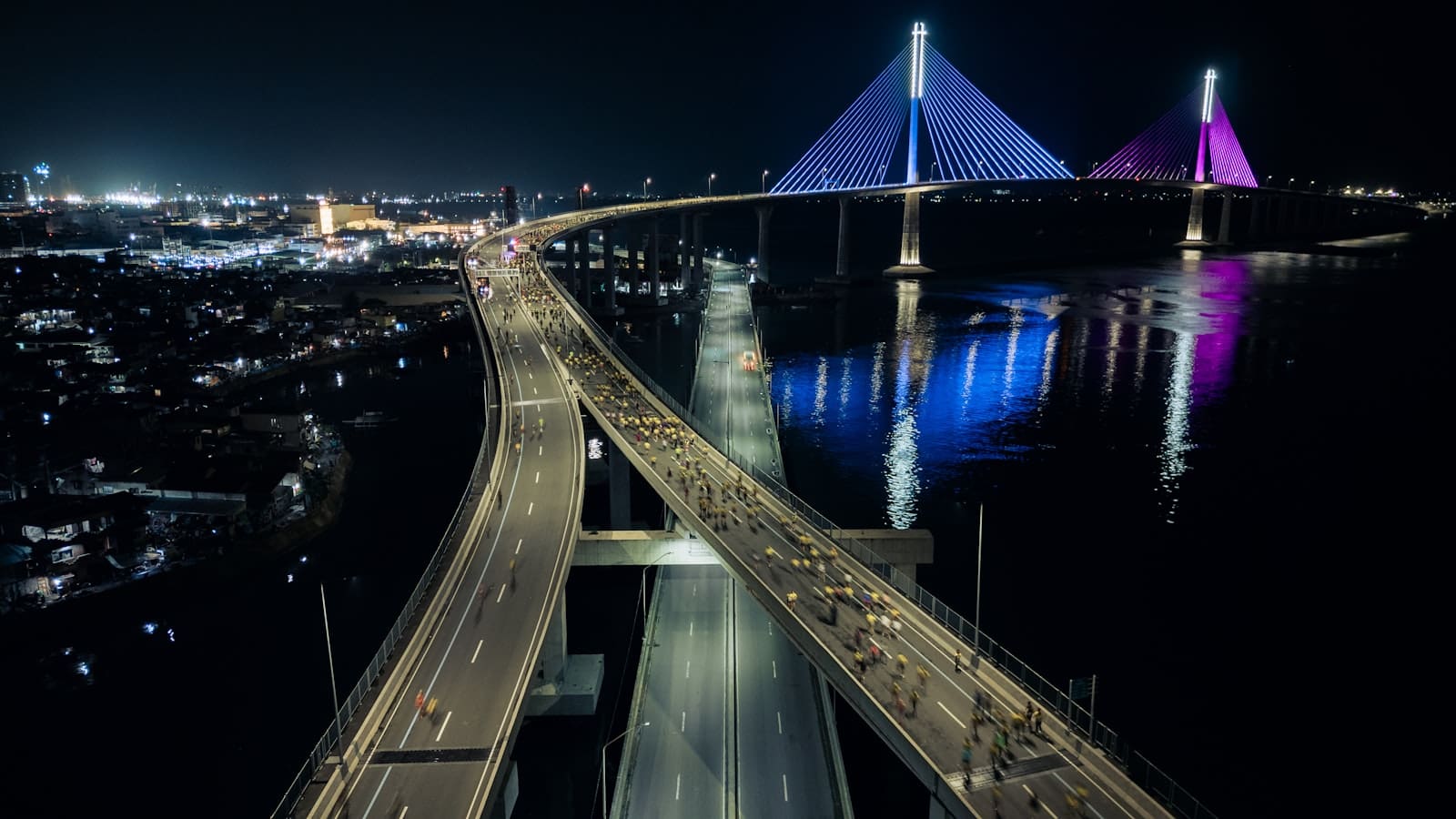 Illuminated cable-stayed bridge over water Cebu City Philippines at night