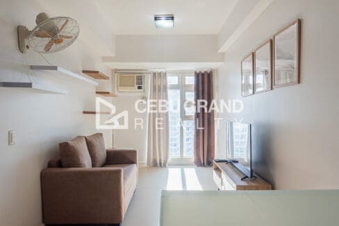 Bright living room seating beside the Solinea balcony