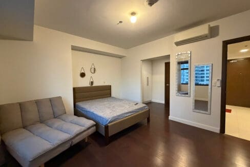 Convertible futon in the bedroom of 1BR corner unit at The Alcoves Cebu Business Park