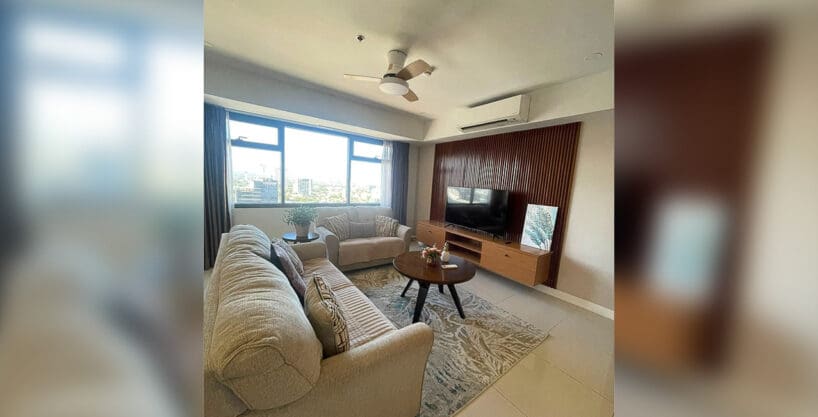 Kitchen with Tecnogas range, marble backsplash, and stainless refrigerator at Alcoves 2BR