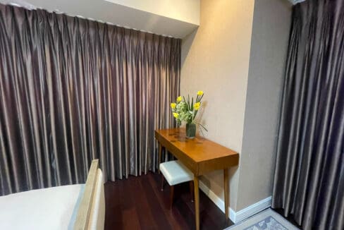 Bathroom with glass-enclosed shower and toilet at Alcoves 2BR