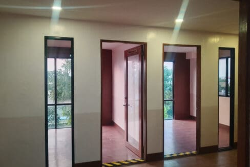 Glass-panelled internal doors dividing the work areas of the 150 sqm office space in Lapu-Lapu
