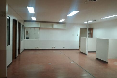 Open floor plate with partition panels and built-in wall cabinetry in the Cebu Yacht Club office space