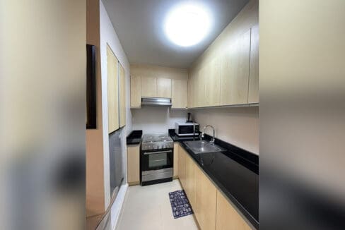 Samsung top-load washing machine in utility nook at Solinea Tower 1 1BR