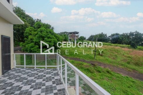 Terrace overlooking the hillside road and neighboring homes