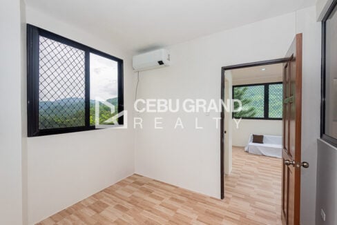 Bedroom with split-type aircon and a window to the mountains