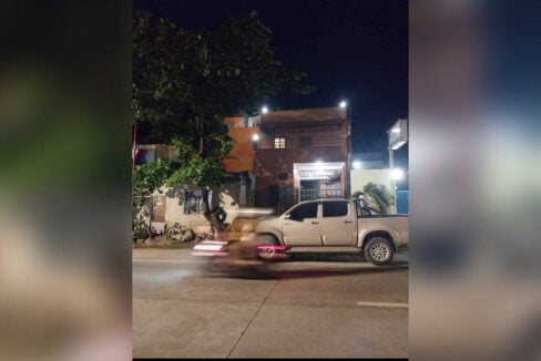 Front of the six-bedroom apartment building at night on General Aviation Road, Lapu-Lapu