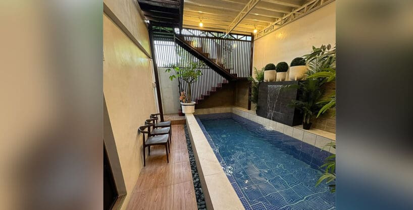 Main entrance foyer with plant and chair at 7BR compound house Cebu City