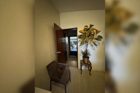 Extension house lounge with massage chair and TV at 7BR compound Cebu City