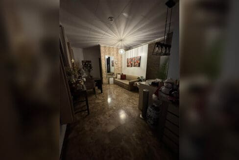 Den or small sitting room with ceiling fan at compound house for sale Cebu City