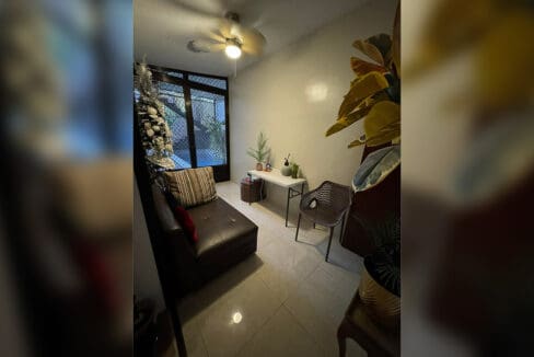 Lap pool with covered deck and wall fountain at 7BR compound house Cebu City
