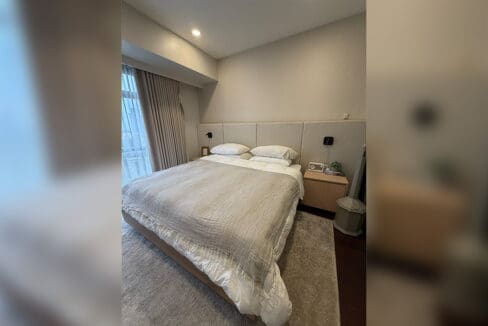 Alcoves condo for sale — master bedroom entry with wooden accent