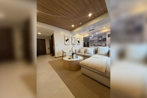 Alcoves condo for sale — second lounge with wooden ceiling accents