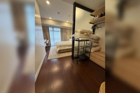 Alcoves condo for sale — secondary bedroom with hardwood floors