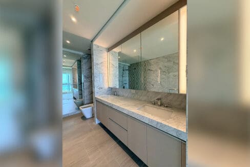 Second bedroom with wardrobe closet and aircon at Aruga Resort beachfront
