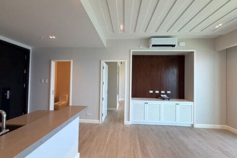 Master bedroom with built-in wardrobes and ensuite bath view at Aruga Resort
