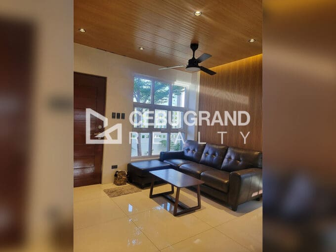 Pacific Grand Villa house for sale — landscaped side garden with tree and paver stones