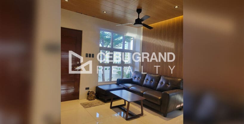 Pacific Grand Villa house for sale — landscaped side garden with tree and paver stones