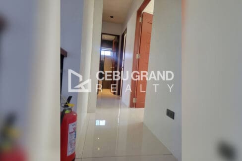 Pacific Grand Villa house for sale — second-floor hallway with wooden doors