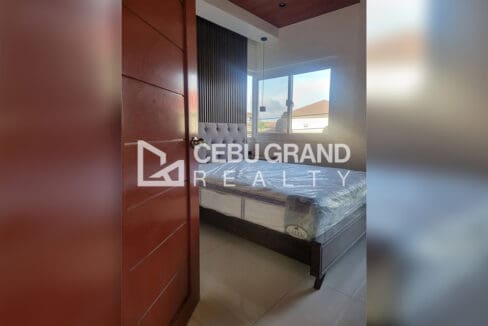 Pacific Grand Villa house for sale — living area with wood ceilings and split-type air-conditioning