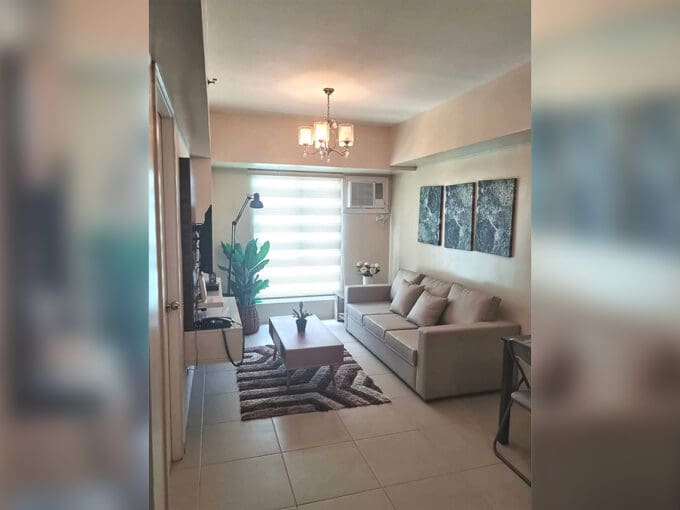 Living and dining area of a furnished 1BR condo for rent at Avida Riala Tower 2, Cebu IT Park
