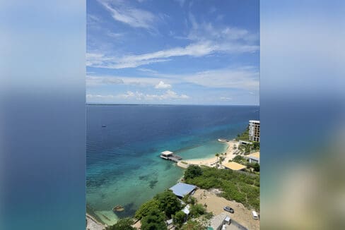 Ocean and headland view over Magellan Bay from the 19th floor at Aruga Residences, Mactan