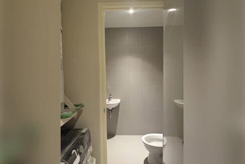 Bathroom with tiled walls and modern fixtures
