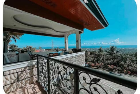 Upper balcony with wrought iron railing and sea view at the house and lot for sale in Maghaway, Talisay
