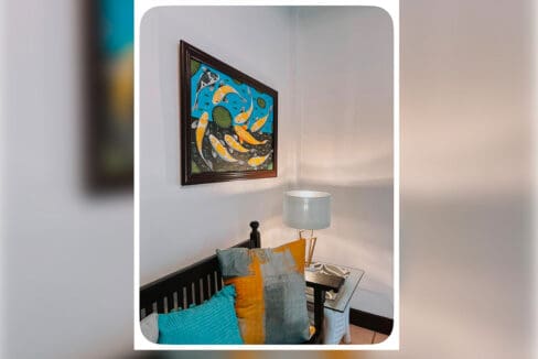 Corner seating with framed artwork and table lamp at the house and lot for sale in Maghaway, Talisay