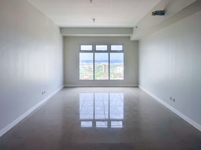 Bedroom with full-height window and city view at the 2 bedroom corner condo for sale at Sedona Parc