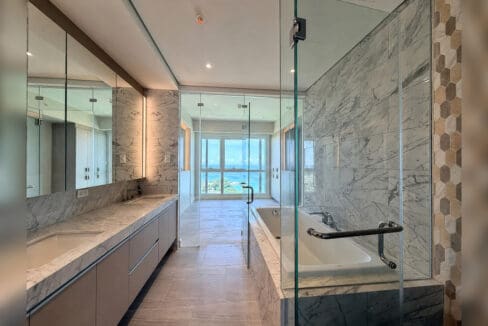 Master ensuite with marble double vanity, soaking tub and rain shower