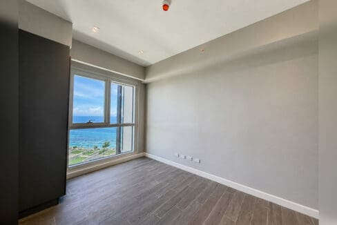 Second bedroom with picture window facing the reef
