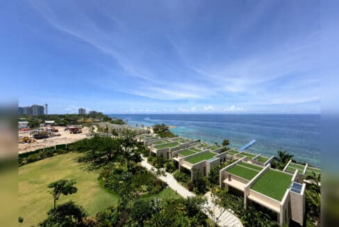 Aerial view of the shoreline gardens and beachfront villas at Aruga