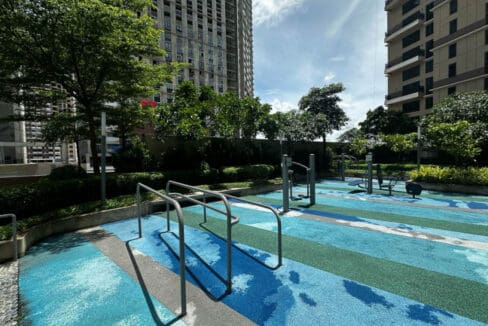 Outdoor swimming pool and lounge area at Mandani Bay