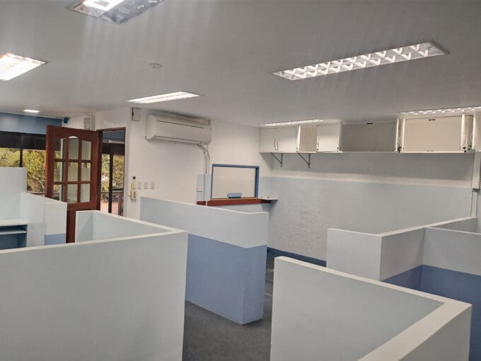 Cubicle workstations and the reception service window in the 126 sqm office at Cebu Yacht Club