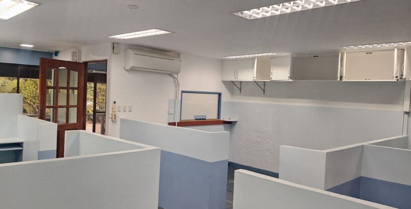 Cubicle workstations and the reception service window in the 126 sqm office at Cebu Yacht Club
