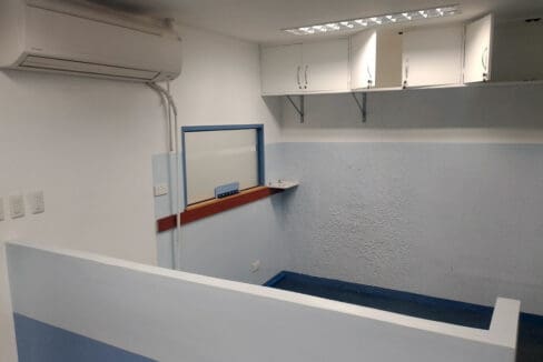 Service window with counter, overhead cabinets and split-type air conditioning