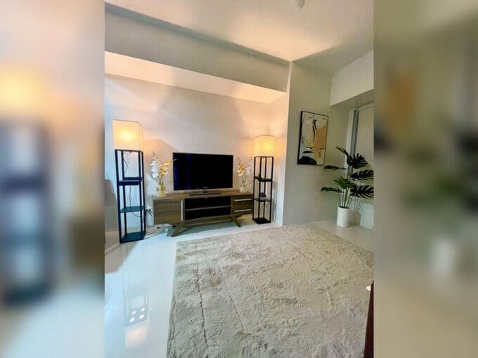 Living area with TV console in a brand-new furnished 1BR condo for rent at Taft East Gate, Mabolo, Cebu City