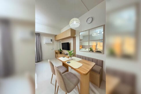 Dining table with banquette seating and a windowpane mirror