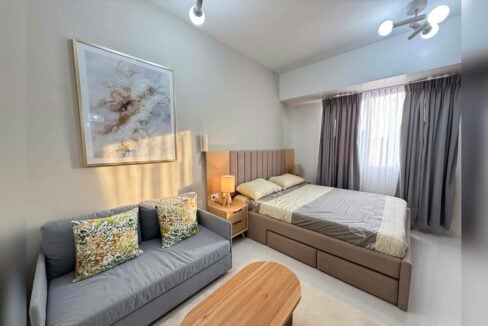 Sofa and bed with an upholstered headboard