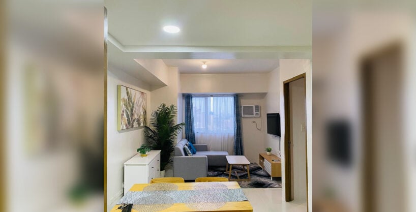 Dining table and living area of the 1 bedroom condo for rent in Mabolo at Taft East Gate