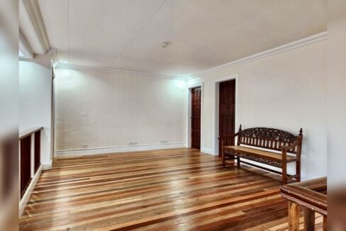 Family area on the second floor with hardwood floors