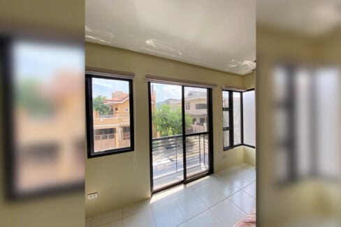 Balcony door and windows looking out over the subdivision